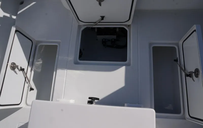  Yacht Photos Pics 2023 Contender 32 ST boat storage compartments open on deck.
