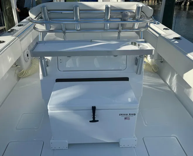  Yacht Photos Pics 2023 Contender 32 ST boat interior with storage and seating area.