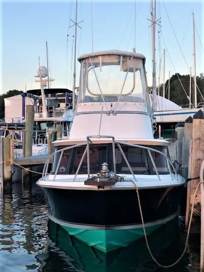 Katama Yacht Photos Pics 1986 Bertram 31 Sportfish Flybridge docked at a marina.