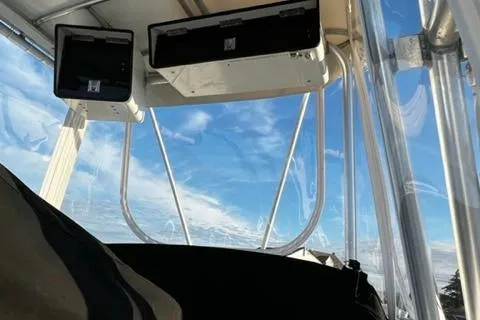 Katama Yacht Photos Pics View from the flybridge of a 1986 Bertram 31 Sportfish boat under a clear sky.