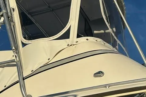 Katama Yacht Photos Pics 1986 Bertram 31 Sportfish Flybridge boat close-up, showcasing the flybridge and canopy.