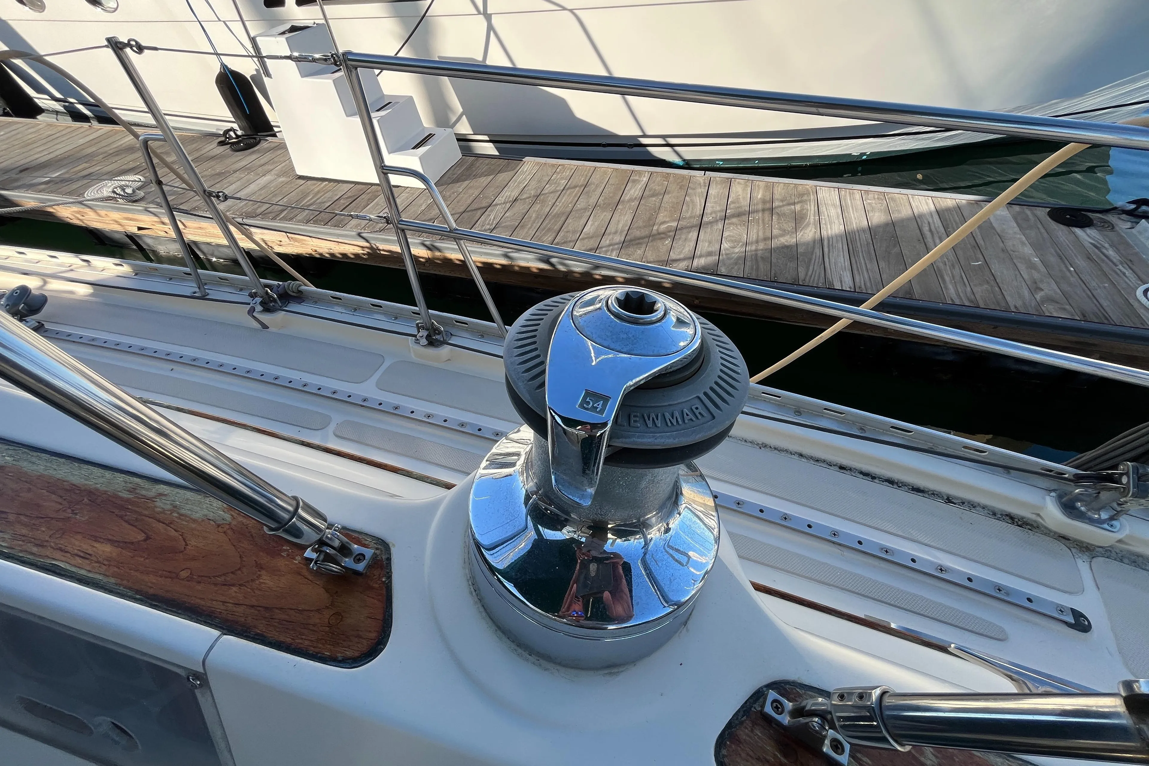 Winch on 1985 Caliber 47LRC sailboat deck, docked at marina.