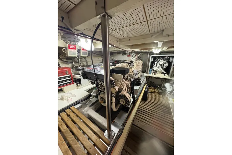 Margo Yacht Photos Pics Engine room of 1996 Grand Banks 42 Classic yacht, showcasing mechanical components and equipment.