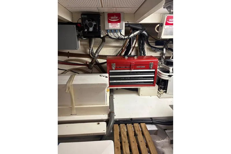 Margo Yacht Photos Pics Engine room of 1996 Grand Banks 42 Classic with red toolbox and wiring.