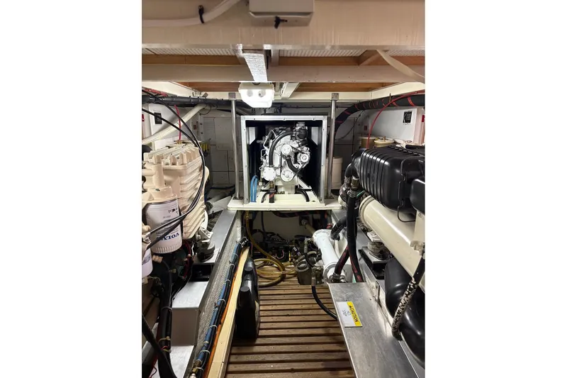 Margo Yacht Photos Pics Engine room of 1996 Grand Banks 42 Classic yacht, showcasing mechanical components and layout.