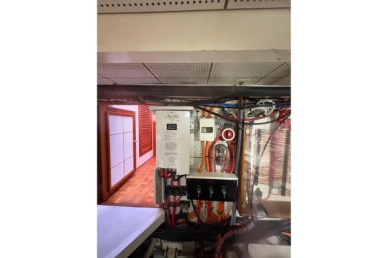 Margo Yacht Photos Pics Electrical panel inside 1996 Grand Banks 42 Classic yacht, showcasing wiring and controls.