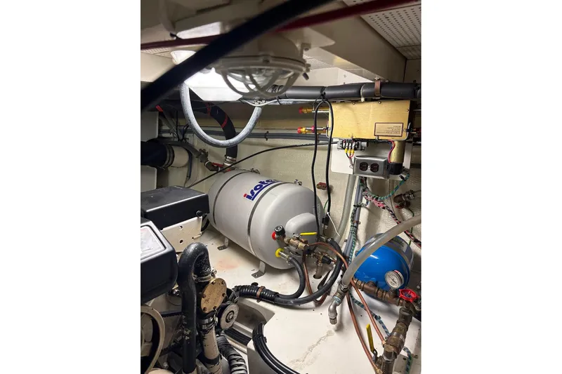 Margo Yacht Photos Pics Engine room of 1996 Grand Banks 42 Classic with mechanical equipment and wiring.