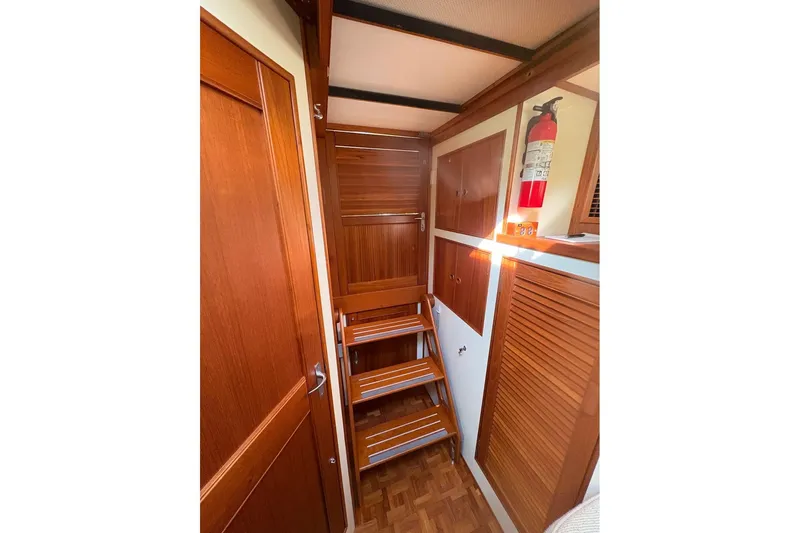Margo Yacht Photos Pics Interior of 1996 Grand Banks 42 Classic yacht with wooden stairs and cabinetry.