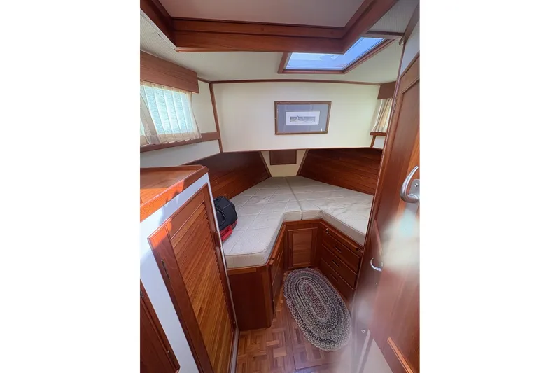 Margo Yacht Photos Pics Cozy cabin interior of 1996 Grand Banks 42 Classic yacht with wooden furnishings.