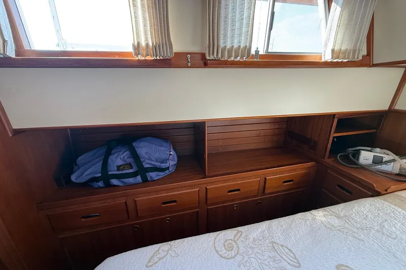 Margo Yacht Photos Pics Interior of 1996 Grand Banks 42 Classic yacht with wooden cabinetry and storage.