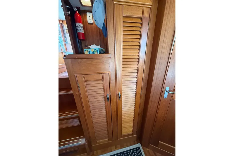 Margo Yacht Photos Pics Wooden interior of 1996 Grand Banks 42 Classic yacht with louvered cabinet doors.