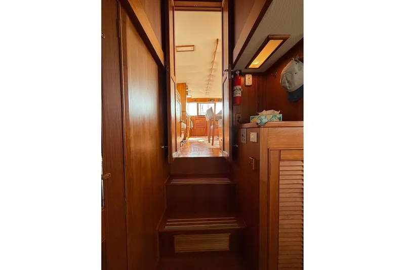 Margo Yacht Photos Pics Interior view of 1996 Grand Banks 42 Classic yacht with wooden stairs and cozy cabin.