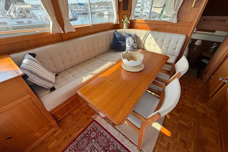 Margo Yacht Photos Pics Interior of 1996 Grand Banks 42 Classic yacht with elegant wood dining area.