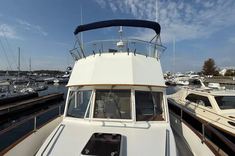 Margo Yacht Photos Pics 1996 Grand Banks 42 Classic yacht docked at marina under clear blue sky.