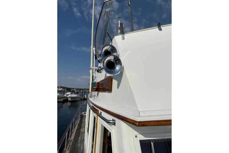 Margo Yacht Photos Pics 1996 Grand Banks 42 Classic yacht detail with chrome horns and wooden accents.