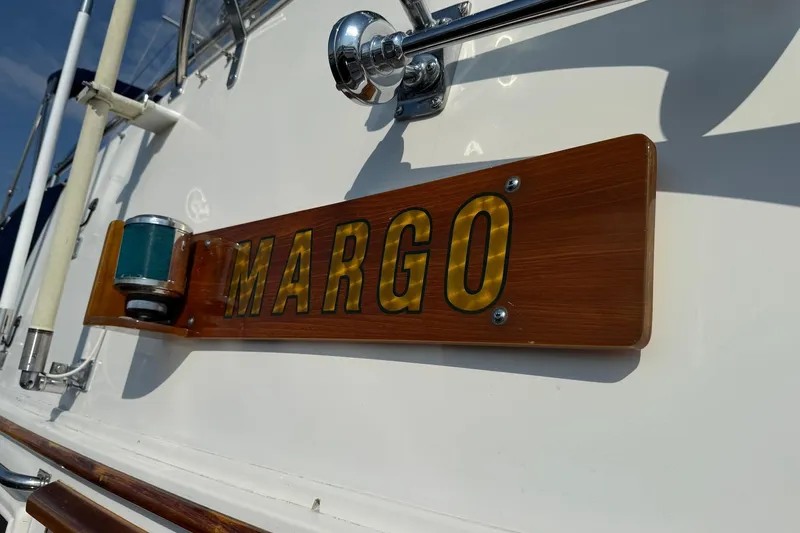 Margo Yacht Photos Pics 1996 Grand Banks 42 Classic boat with "MARGO" nameplate on wooden plaque.