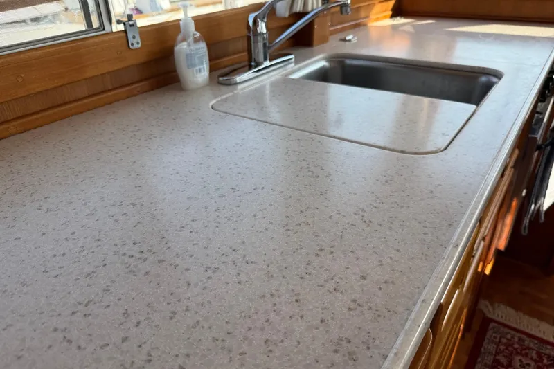 Margo Yacht Photos Pics Kitchen sink and countertop on a 1996 Grand Banks 42 Classic yacht.