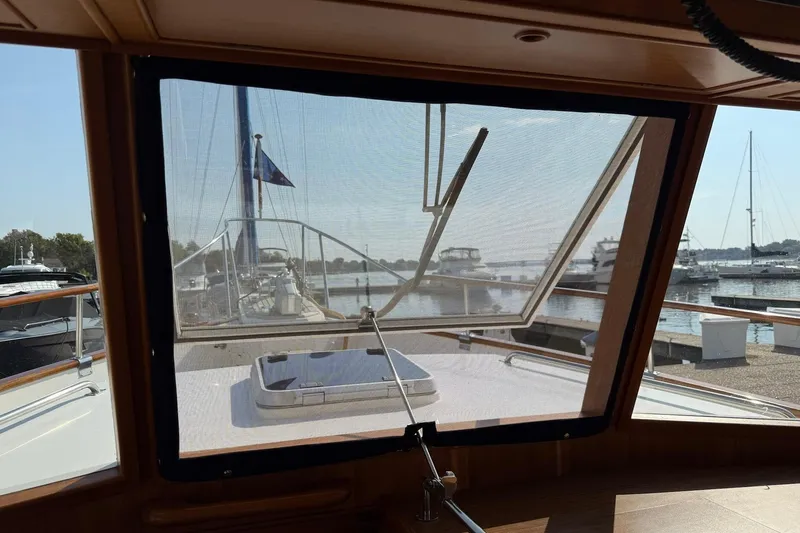 Margo Yacht Photos Pics 1996 Grand Banks 42 Classic yacht interior view through window at marina.