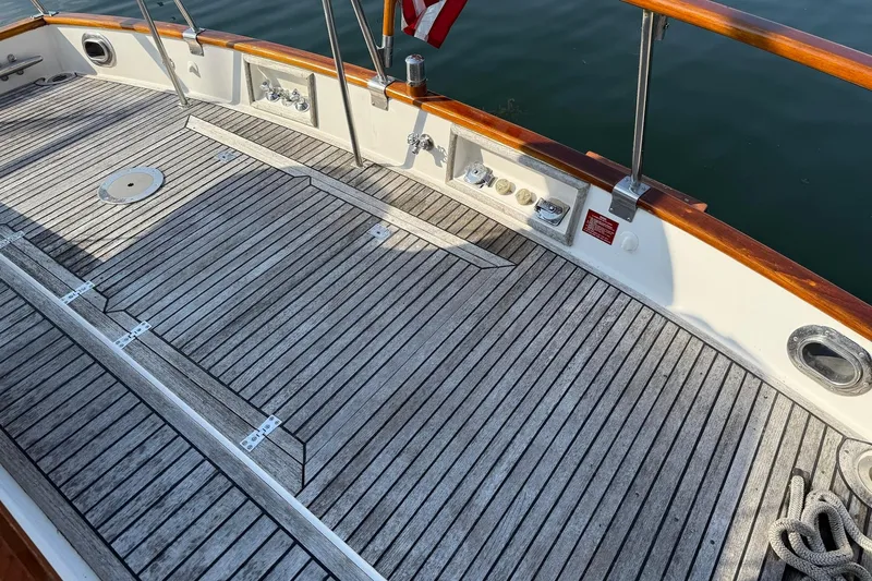 Margo Yacht Photos Pics Teak deck of 1996 Grand Banks 42 Classic yacht with polished wood railings.