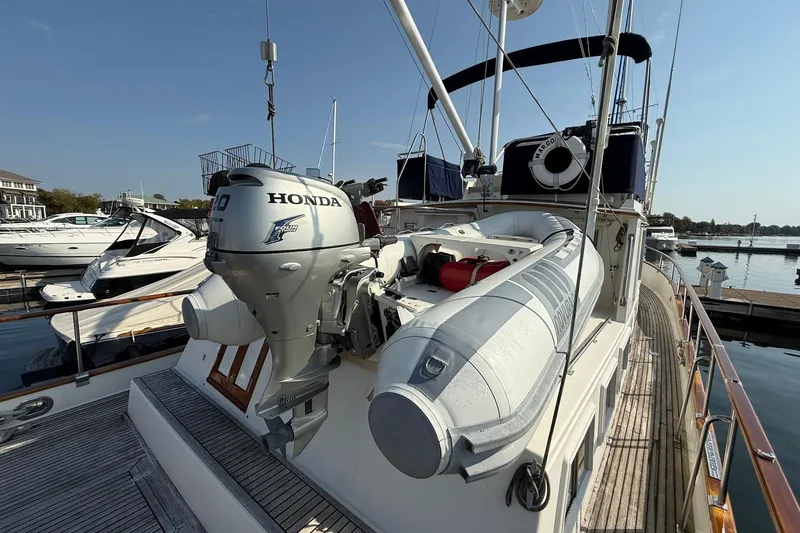 Margo Yacht Photos Pics Grand Banks 42 Classic 1996 yacht with Honda outboard motor and inflatable boat on deck.