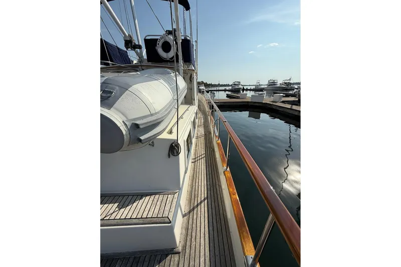 Margo Yacht Photos Pics Side view of 1996 Grand Banks 42 Classic yacht docked at marina.