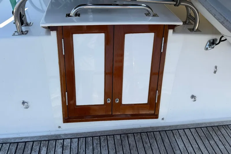 Margo Yacht Photos Pics Wooden cabinet on 1996 Grand Banks 42 Classic yacht deck.