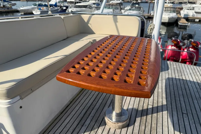 Margo Yacht Photos Pics Teak table and seating on 1996 Grand Banks 42 Classic yacht deck.