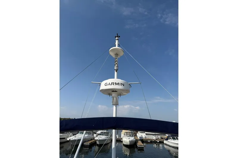 Margo Yacht Photos Pics Radar equipment on a 1996 Grand Banks 42 Classic yacht, docked at a marina.