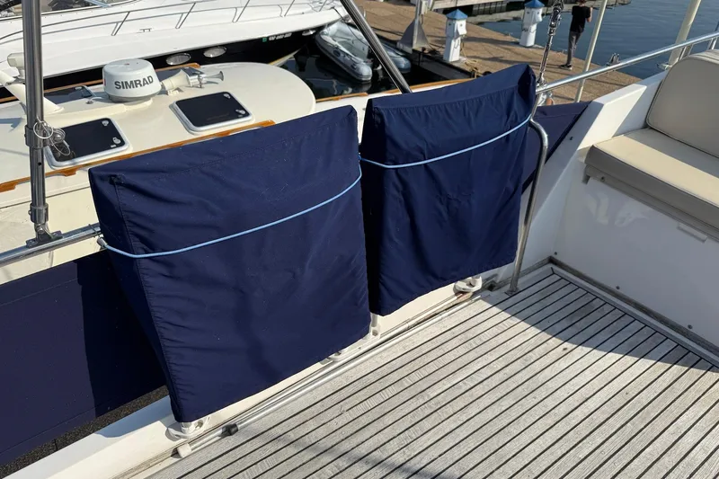 Margo Yacht Photos Pics Deck of 1996 Grand Banks 42 Classic yacht with covered equipment and seating.