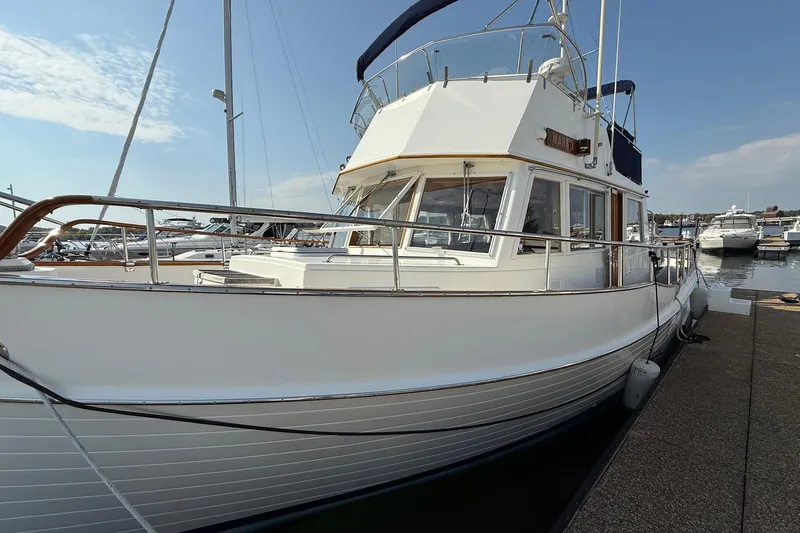 Margo Yacht Photos Pics 1996 Grand Banks 42 Classic yacht docked at marina under clear sky.
