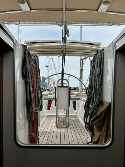 Blue Moon Yacht Photos Pics Beneteau First 47.7 sailboat cockpit, 2003 model, with ropes and steering wheel visible.