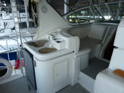  Yacht Photos Pics 2001 Cruisers Yachts 4450 Express Motoryacht interior with seating and kitchenette area.