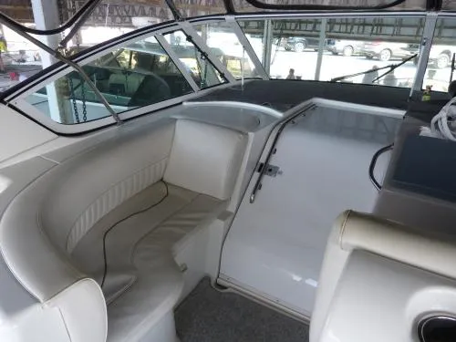  Yacht Photos Pics 2001 Cruisers Yachts 4450 Express Motoryacht interior with white seating and helm area.