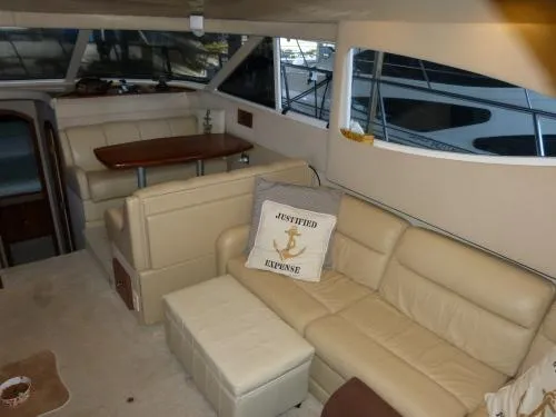  Yacht Photos Pics Luxurious interior of 2001 Cruisers Yachts 4450 Express Motoryacht with beige leather seating.