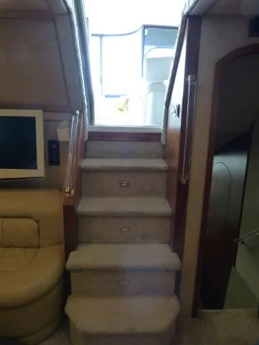  Yacht Photos Pics Staircase inside 2001 Cruisers Yachts 4450 Express Motoryacht, leading to upper deck.