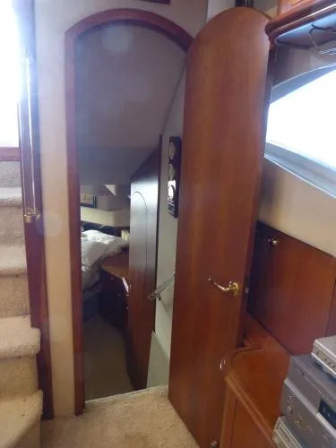  Yacht Photos Pics Interior view of 2001 Cruisers Yachts 4450 Express Motoryacht cabin with open door.