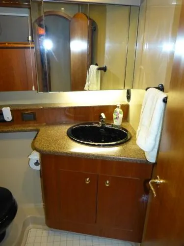  Yacht Photos Pics Luxurious bathroom in 2001 Cruisers Yachts 4450 Express Motoryacht with elegant fixtures.