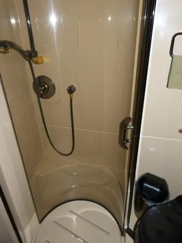  Yacht Photos Pics Shower area in 2001 Cruisers Yachts 4450 Express Motoryacht bathroom.
