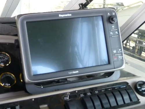  Yacht Photos Pics Raymarine navigation system on 2001 Cruisers Yachts 4450 Express Motoryacht dashboard.