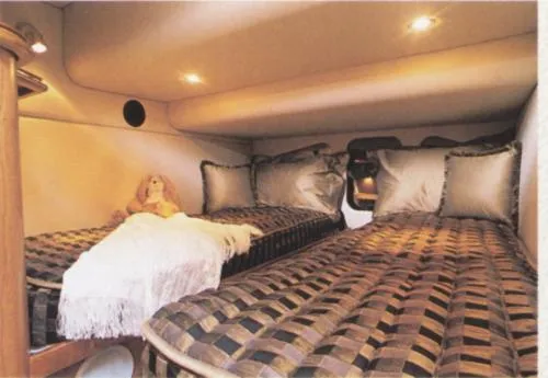  Yacht Photos Pics Luxurious twin beds in 2001 Cruisers Yachts 4450 Express Motoryacht cabin.