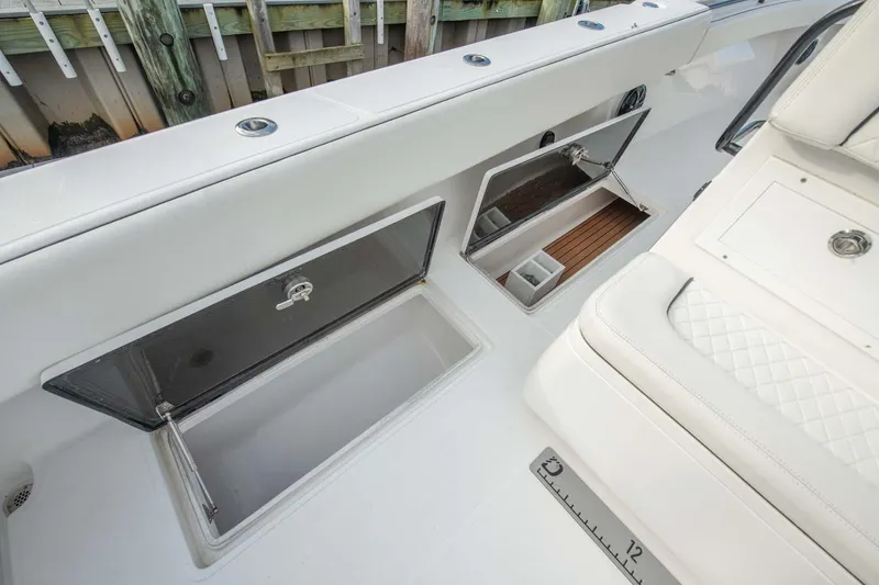 Mr Fish Yacht Photos Pics 2016 SeaHunter 35 Tournament boat interior with open storage compartments.