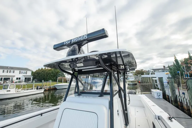 Mr Fish Yacht Photos Pics 2016 SeaHunter 35 Tournament boat docked in a marina under cloudy skies.