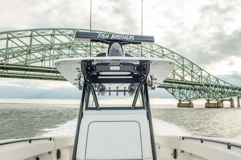 Mr Fish Yacht Photos Pics SeaHunter 35 Tournament boat cruising under a bridge, 2016 model.