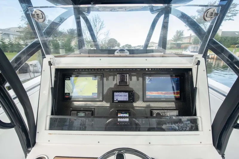 Mr Fish Yacht Photos Pics 2016 SeaHunter 35 Tournament boat dashboard with navigation screens and controls.