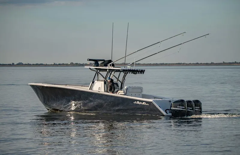 Mr Fish Yacht Photos Pics 2016 SeaHunter 35 Tournament boat on calm water with fishing rods.
