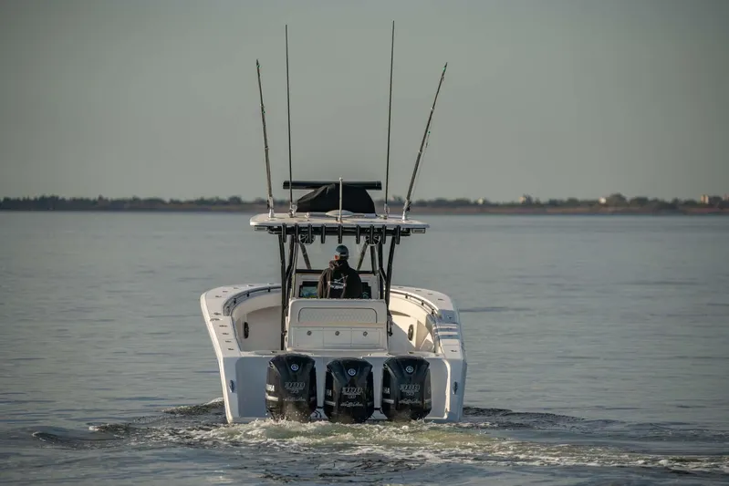 Mr Fish Yacht Photos Pics 2016 SeaHunter 35 Tournament boat with triple engines cruising on calm water.