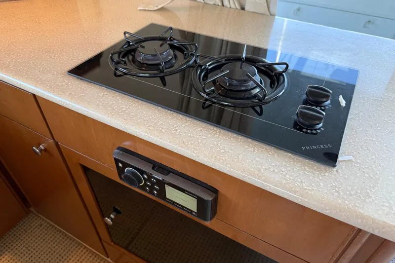  Yacht Photos Pics 2005 Meridian 341 Sedan kitchen with Princess stovetop and audio system.