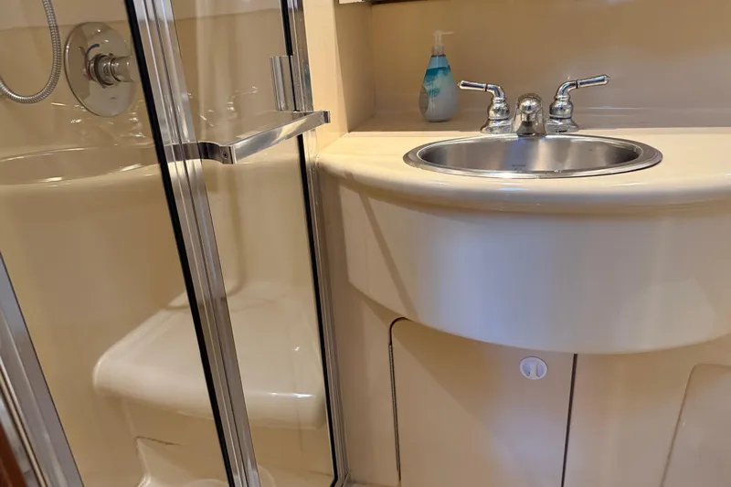  Yacht Photos Pics Bathroom interior of 2005 Meridian 341 Sedan yacht with sink and shower.