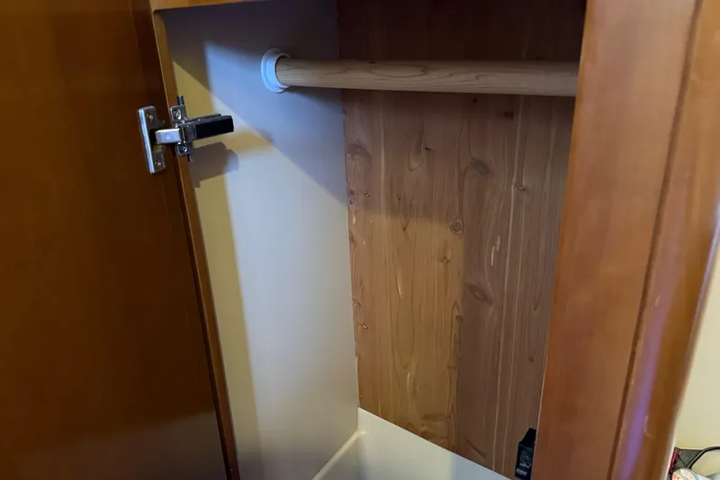  Yacht Photos Pics Wooden closet interior in a 2005 Meridian 341 Sedan boat.