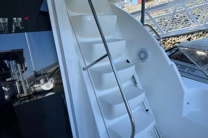 Yacht Photos Pics Staircase on 2005 Meridian 341 Sedan yacht with dockside view.